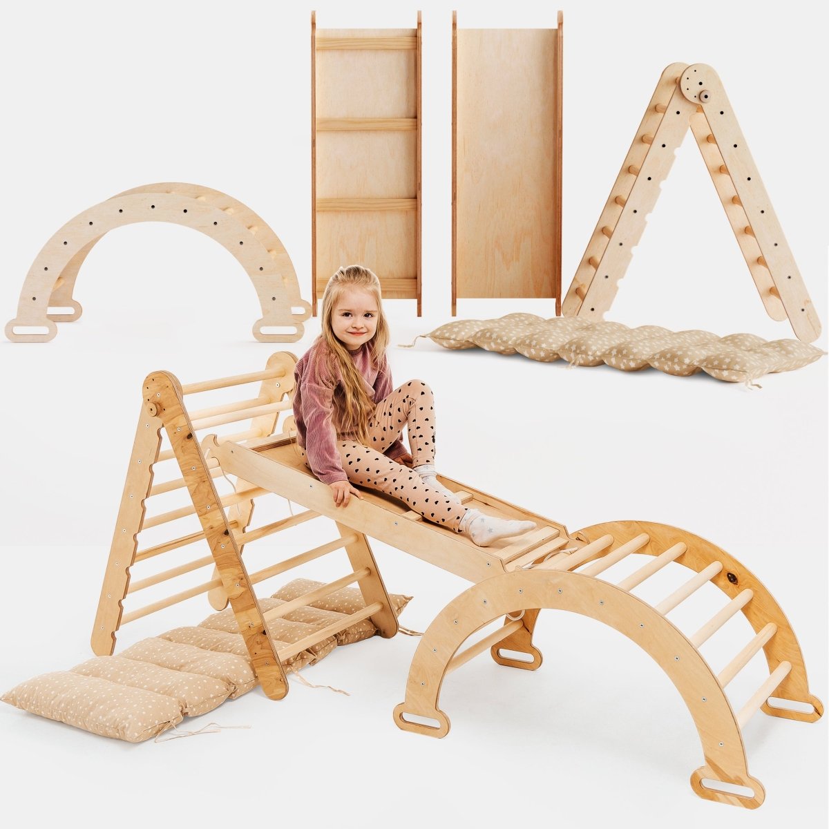 Child playing on a wooden climbing toy set with a white background Main image