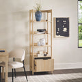 Light wooden bookshelf with decorative items in a room with a chair and table.