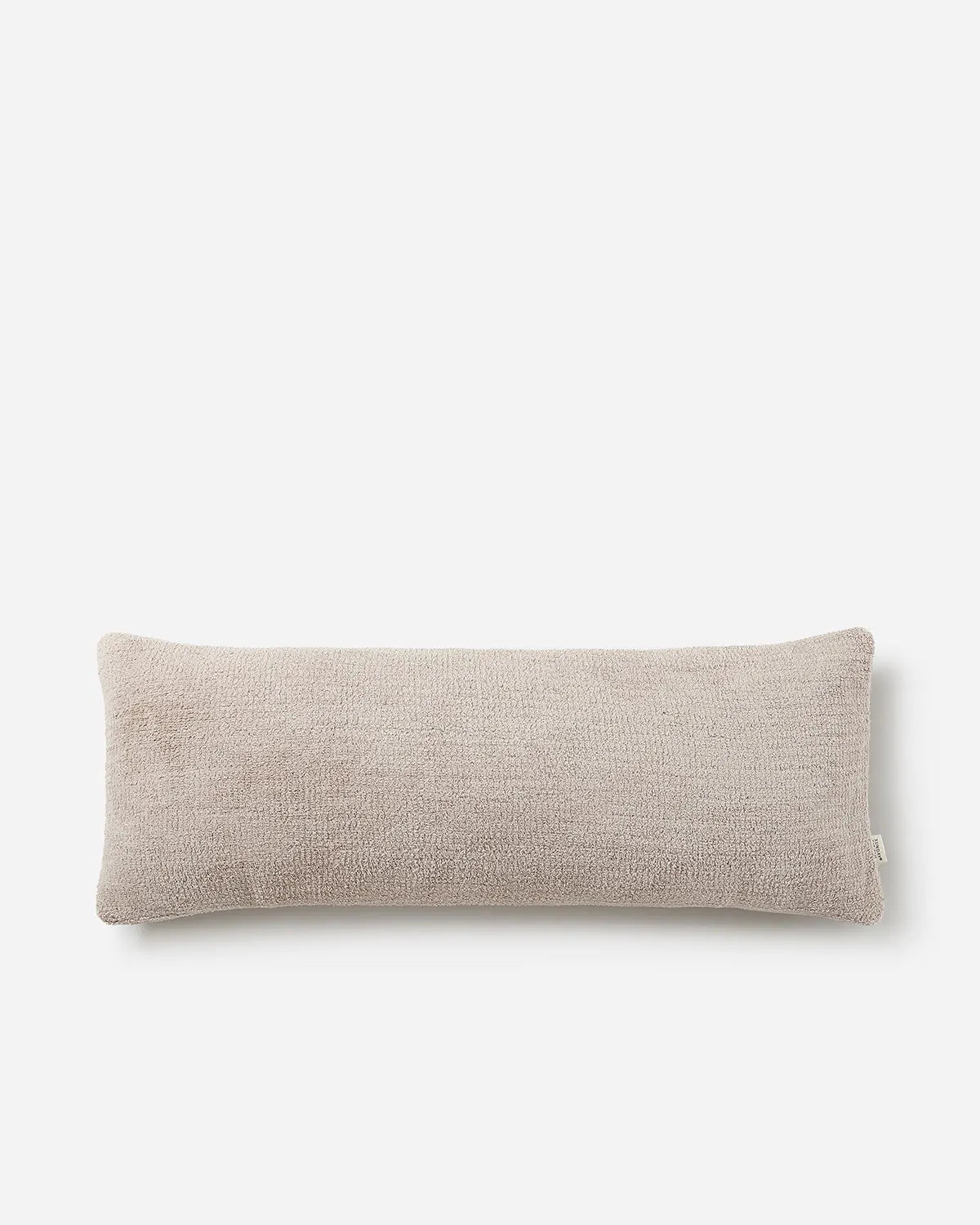 Beige rectangular pillow on a white background