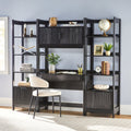 Black corner office desk with shelves and a chair against a light blue wall.